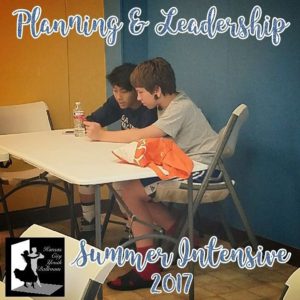 Two of Kansas City Youth Ballroom Senior Level dancers plan a warm-up session during the Summer Intensive Session.